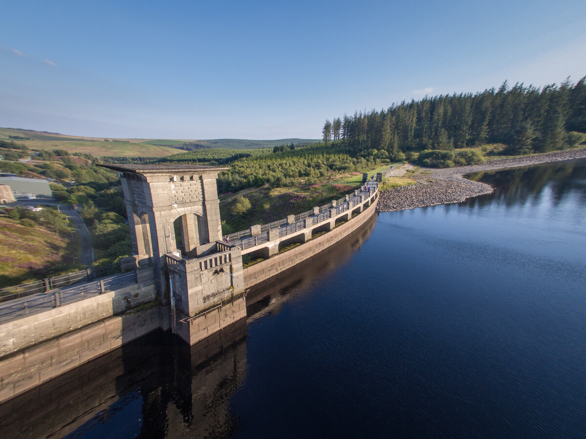 An image of Alwen Dam and reservoir on a sunny day